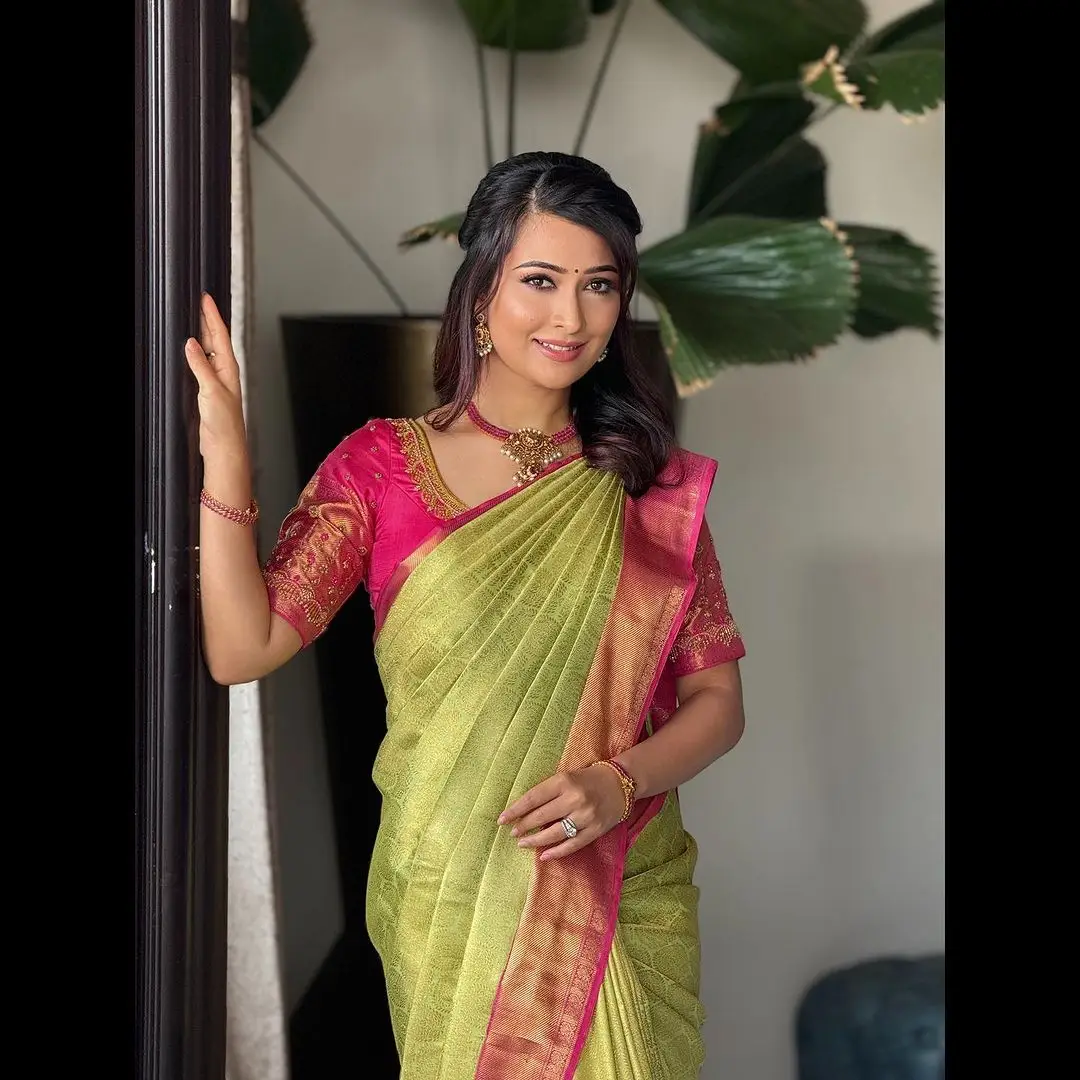 RADHIKA PANDIT STILLS IN GREEN SAREE RED BLOUSE